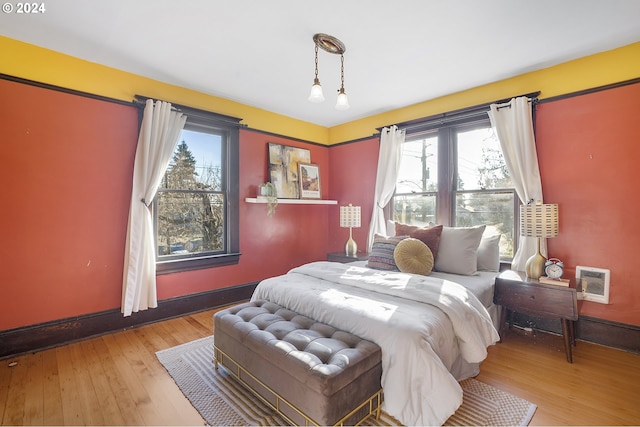 bedroom with light hardwood / wood-style floors