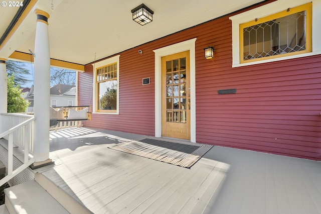 doorway to property featuring a porch