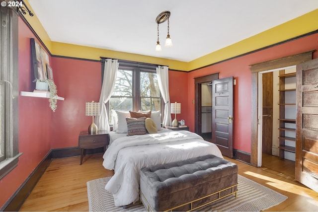 bedroom featuring wood-type flooring