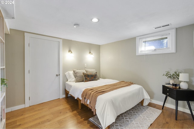 bedroom featuring hardwood / wood-style flooring