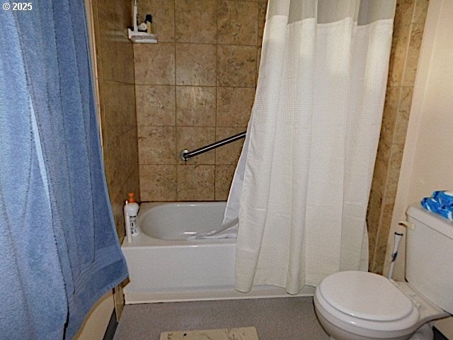 bathroom with shower / bath combo and toilet