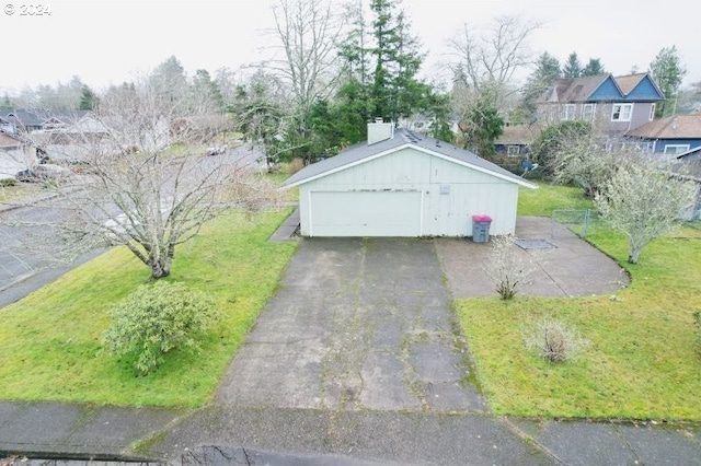 garage featuring a lawn