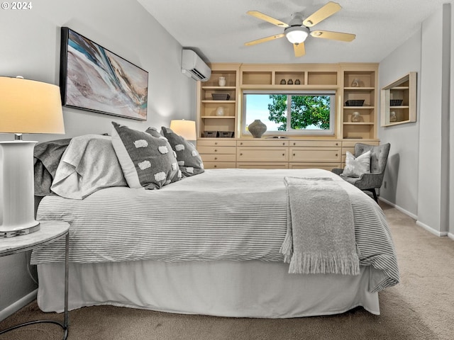 bedroom with carpet, ceiling fan, and a wall mounted air conditioner