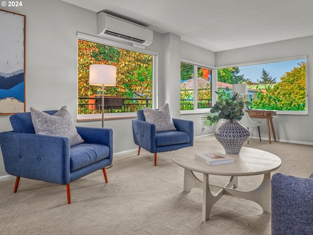 sitting room featuring carpet flooring, a textured ceiling, and a wall mounted air conditioner