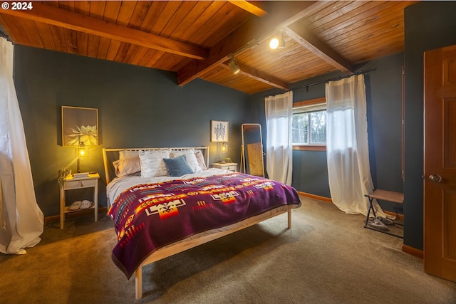 bedroom with track lighting, lofted ceiling with beams, carpet, and wooden ceiling