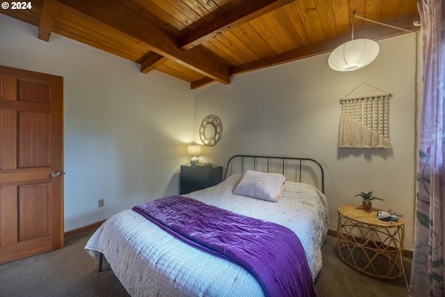 bedroom featuring dark carpet, wooden ceiling, and beam ceiling