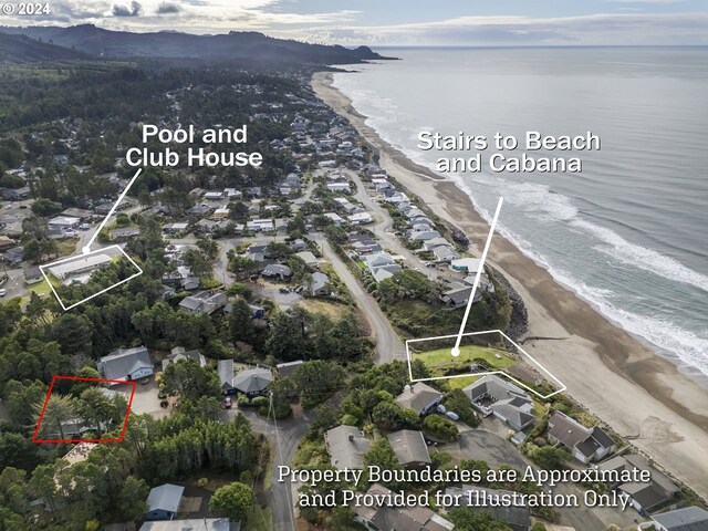 bird's eye view featuring a view of the beach and a water and mountain view