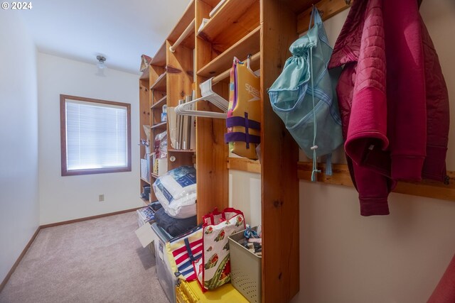 laundry room with a healthy amount of sunlight, wood ceiling, and separate washer and dryer