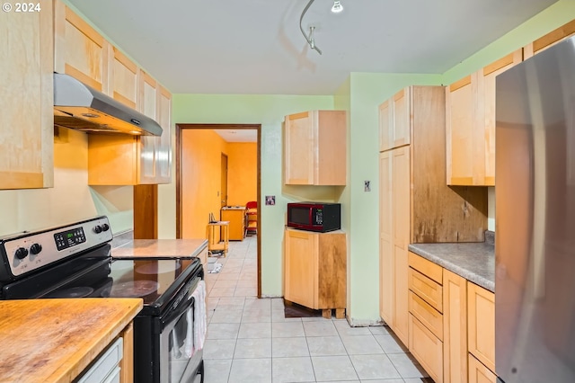 kitchen with ventilation hood, stainless steel appliances, light tile patterned floors, and light brown cabinetry