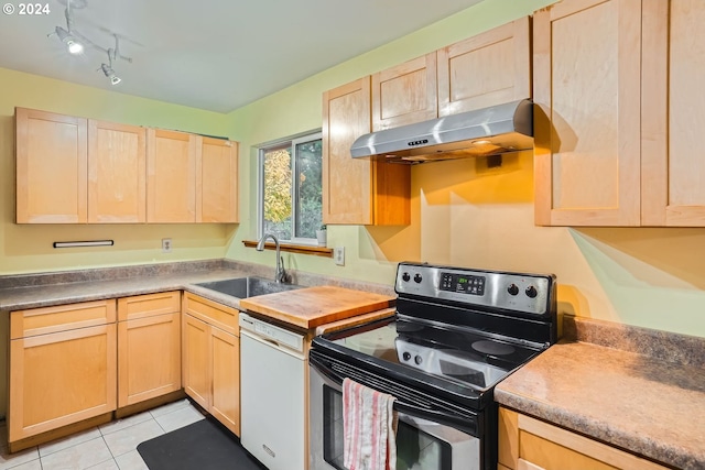 kitchen featuring sink, white dishwasher, light brown cabinets, light tile patterned floors, and stainless steel range with electric stovetop