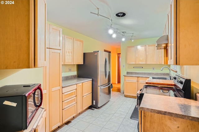 kitchen featuring sink, exhaust hood, light brown cabinets, light tile patterned floors, and black appliances