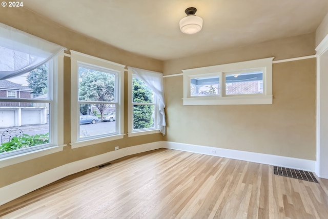 unfurnished room featuring light hardwood / wood-style flooring