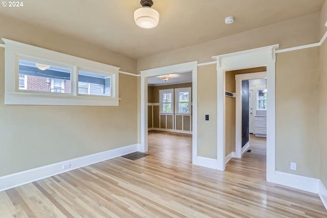 spare room with light hardwood / wood-style floors