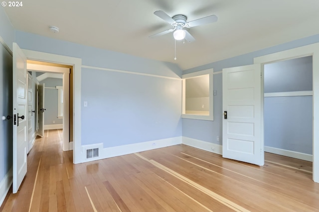 unfurnished bedroom featuring ceiling fan, a closet, and light hardwood / wood-style floors