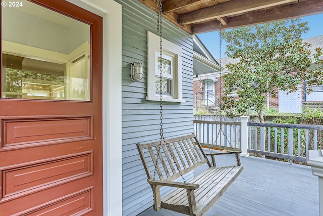 wooden deck featuring covered porch