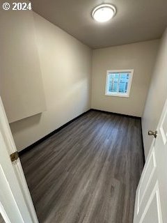 empty room featuring dark hardwood / wood-style flooring