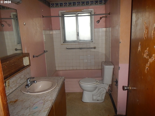 full bathroom with tiled shower / bath combo, vanity, and toilet