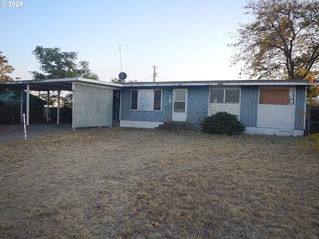 view of front of property with a carport