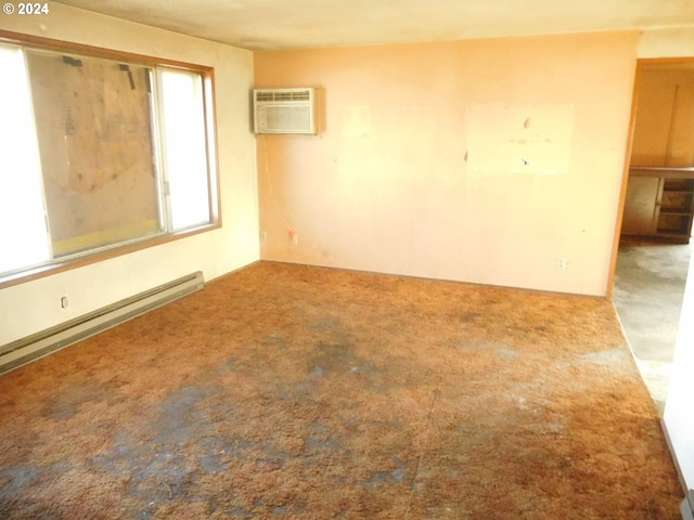 carpeted spare room with baseboard heating and a wall unit AC