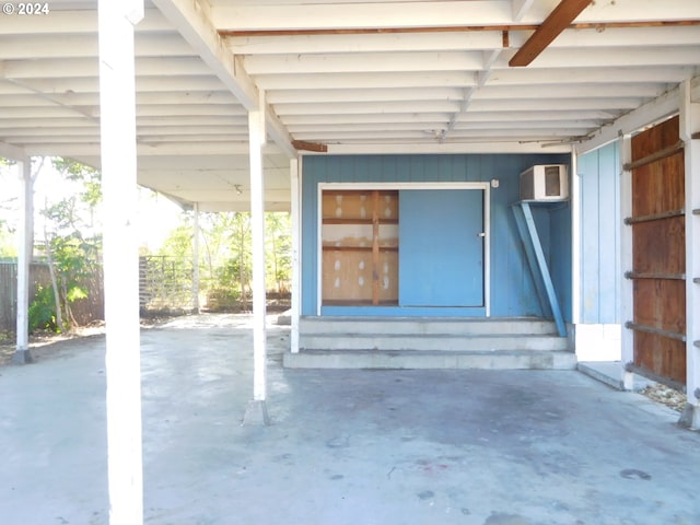 view of patio with an AC wall unit