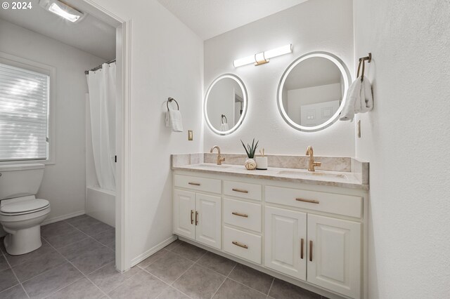 full bathroom with shower / bath combination with curtain, vanity, toilet, and tile patterned floors