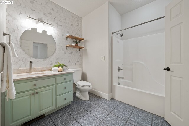 full bathroom featuring vanity, toilet, shower / bathing tub combination, and tile patterned floors