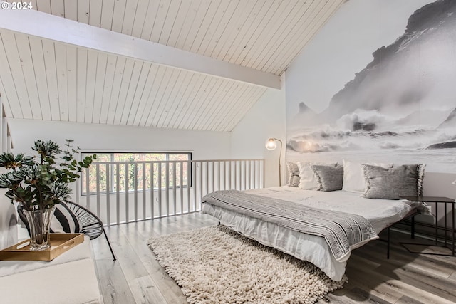 bedroom with high vaulted ceiling, beam ceiling, light hardwood / wood-style floors, and wooden ceiling