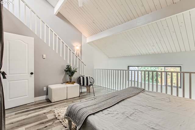 bedroom featuring light hardwood / wood-style floors, wood ceiling, beamed ceiling, and high vaulted ceiling