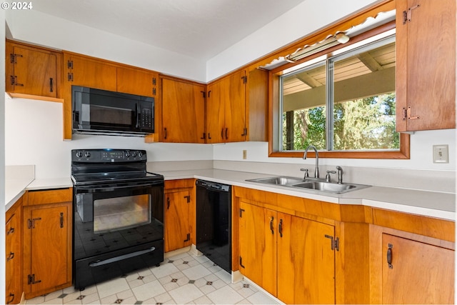 kitchen featuring black appliances and sink