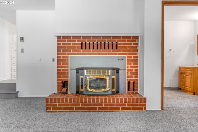 details featuring a wood stove and carpet floors