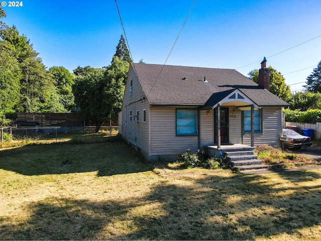 view of front of property with a front lawn