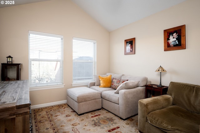 living room with vaulted ceiling and a wealth of natural light