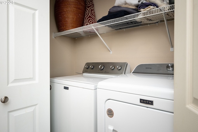 laundry room with independent washer and dryer