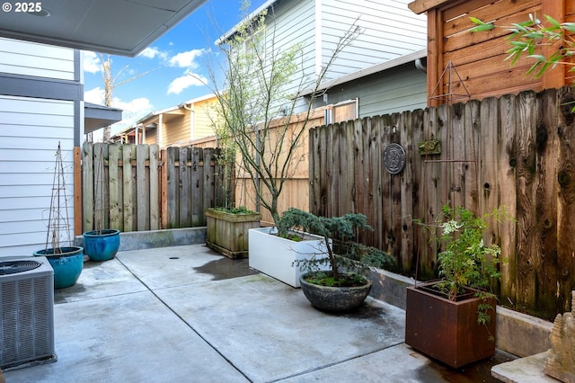 view of patio with central AC