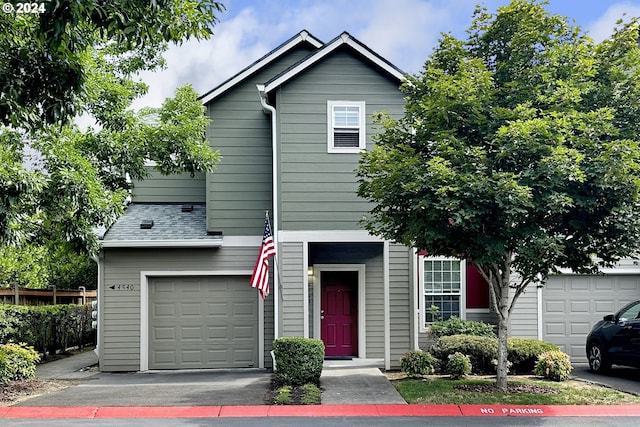 view of front of property with a garage and driveway