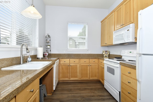 kitchen featuring light brown cabinetry, white appliances, dark wood-type flooring, sink, and decorative light fixtures