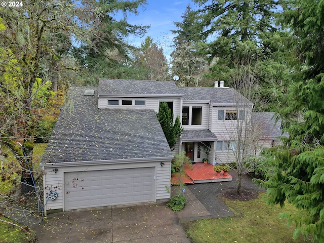 92932 Paschelke Rd, Marcola, OR 97454 - view of front facade featuring a chimney, a garage, roof with shingles, and a deck