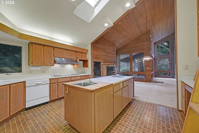 92932 Paschelke Rd, Marcola, OR 97454 - kitchen featuring black appliances, under cabinet range hood, a sink, a center island with sink, and wooden walls