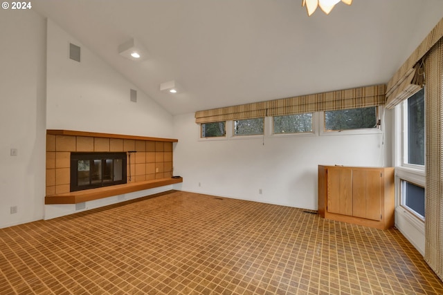 92932 Paschelke Rd, Marcola, OR 97454 - unfurnished living room featuring lofted ceiling, a tiled fireplace, and recessed lighting