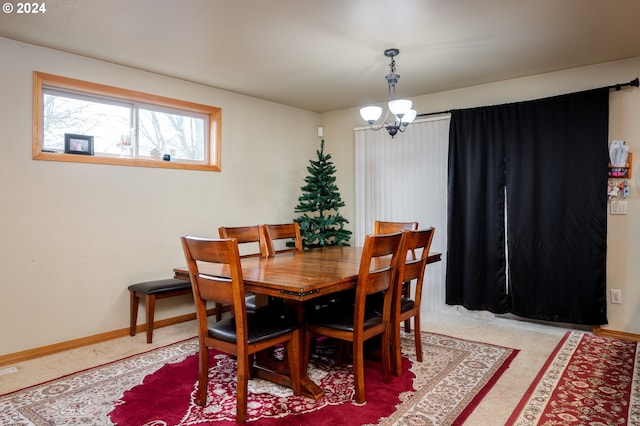 dining space with a notable chandelier