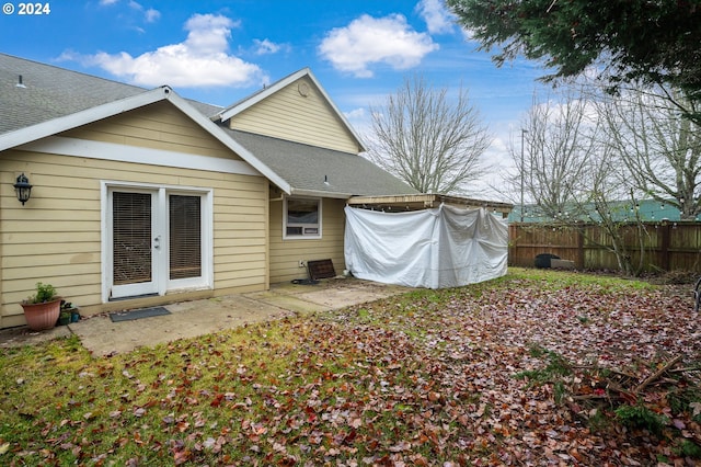 rear view of property featuring a patio