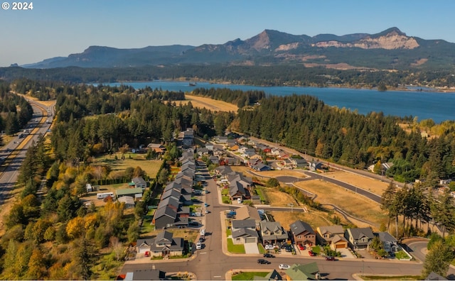 bird's eye view featuring a water and mountain view