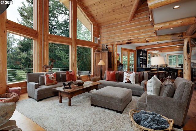 living room with wood finished floors, high vaulted ceiling, recessed lighting, wooden ceiling, and beamed ceiling