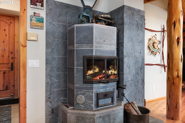 interior details with wood finished floors and a fireplace