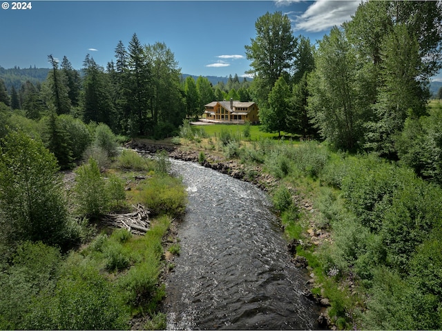 surrounding community featuring a view of trees