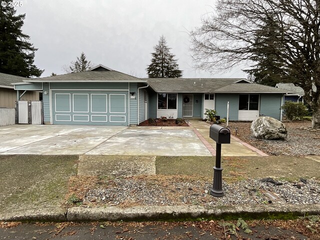 ranch-style home featuring a garage