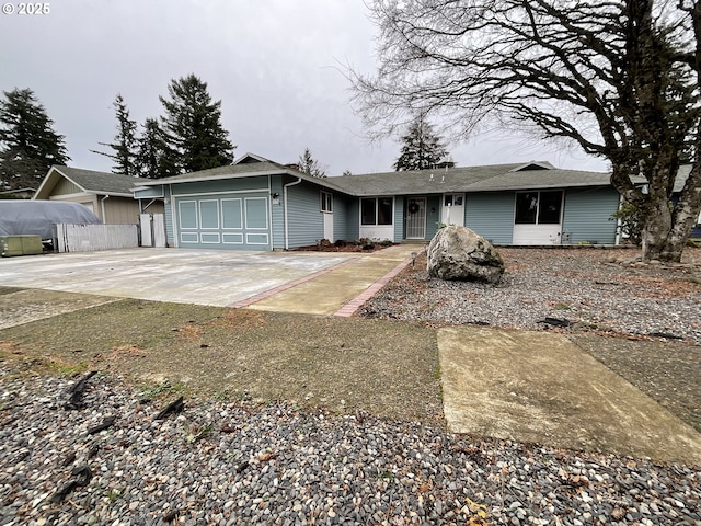 ranch-style home featuring a garage