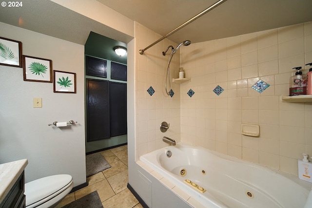 full bathroom with tile patterned floors, vanity, toilet, and tiled shower / bath