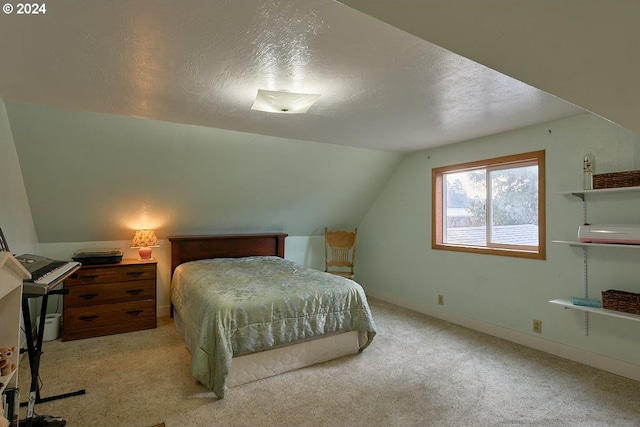 bedroom with light colored carpet, lofted ceiling, and a textured ceiling