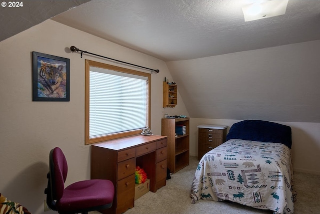 carpeted bedroom featuring lofted ceiling and a textured ceiling